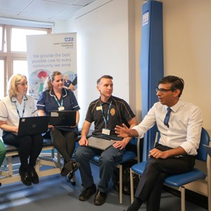 Rishi Sunak with health and care staff in Leeds