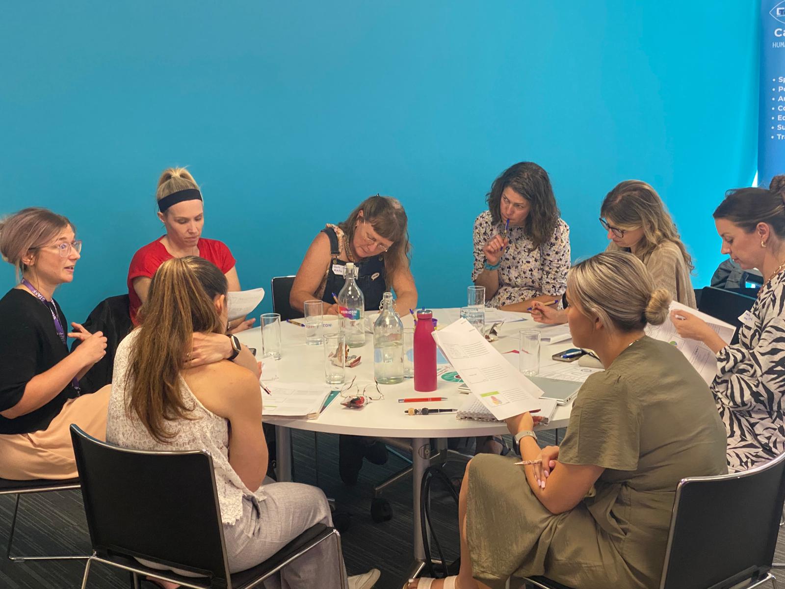 Attendees sat at a table
