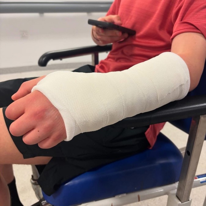 Child with arm in plaster