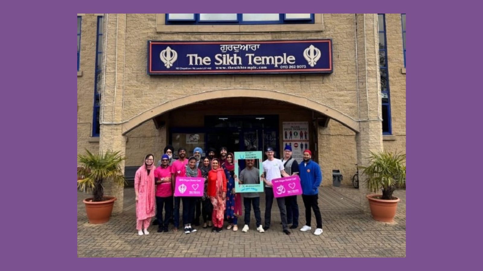 Image of people smiling outside Sikh Temple 