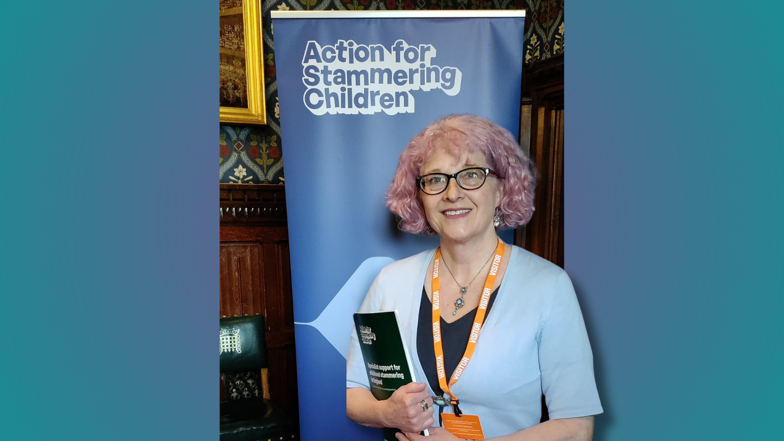 Image of Steph Burgess in front of banner than says Action for stammering children