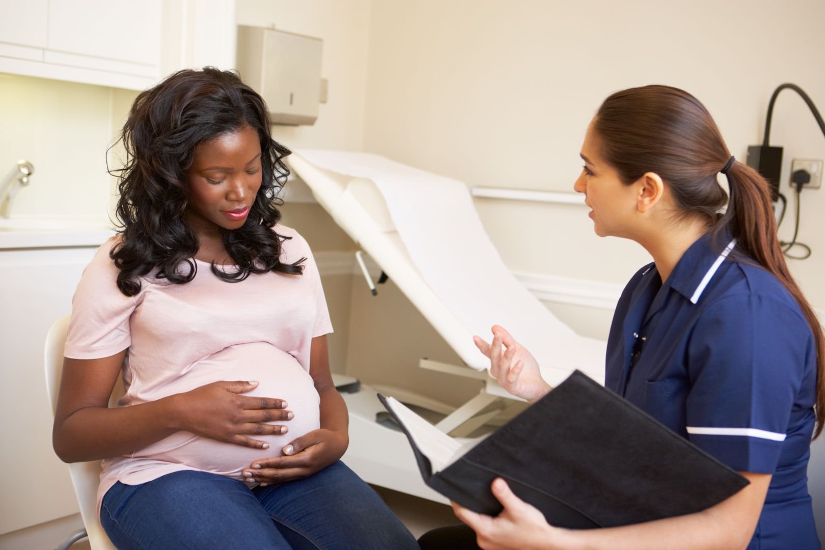 Pregnant mum talking to a midwife