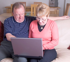 Couple using a laptop