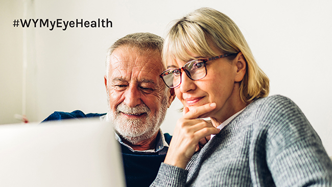 A couple looking at the My Eye Health website on a laptop