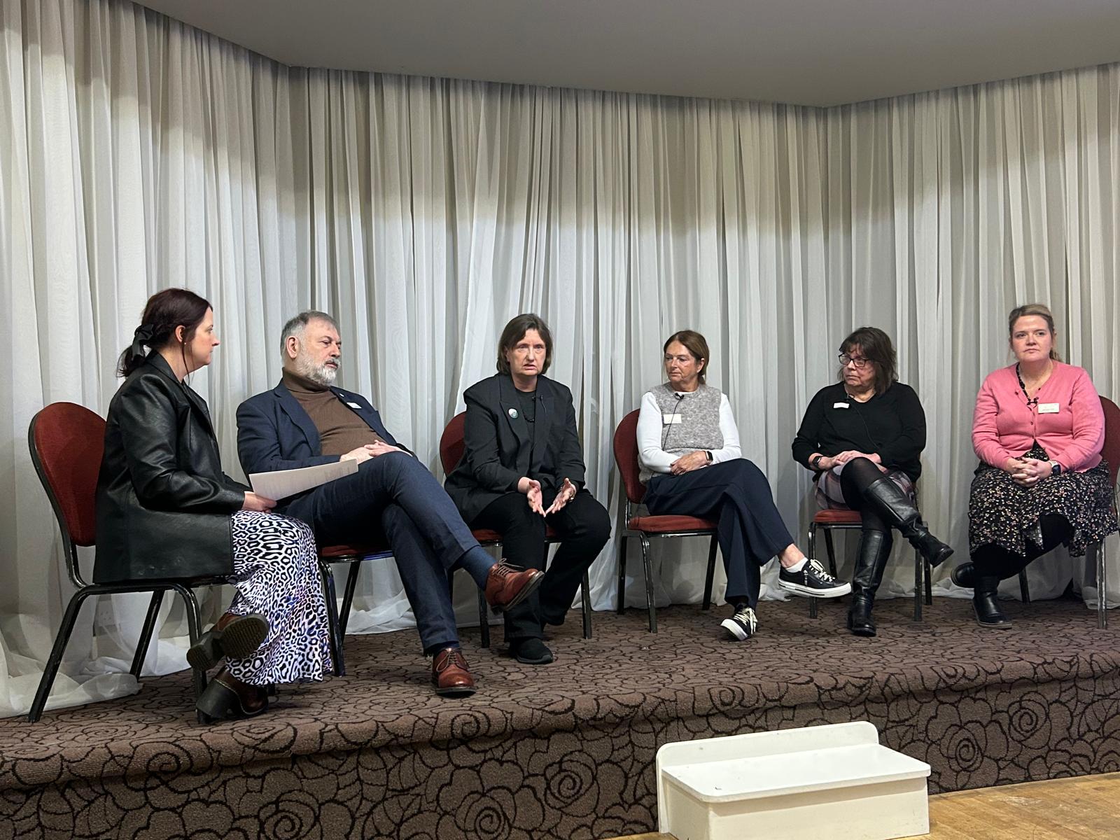 Amy first on the left with five other panel members 