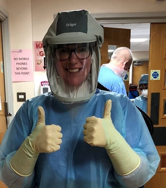 CHFT staff member wearing Personal Protective Equipment, giving the "thumbs up" sign