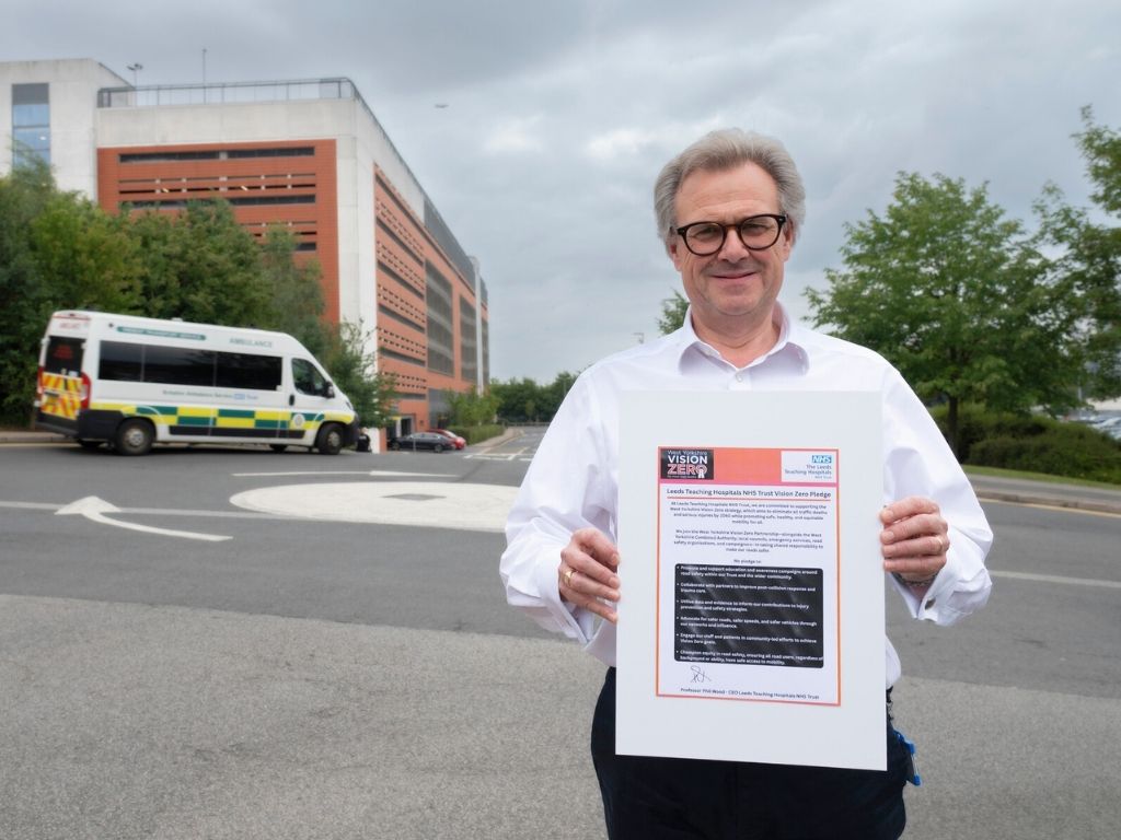 Dr Phil Wood withe the Vision Zero strategy document