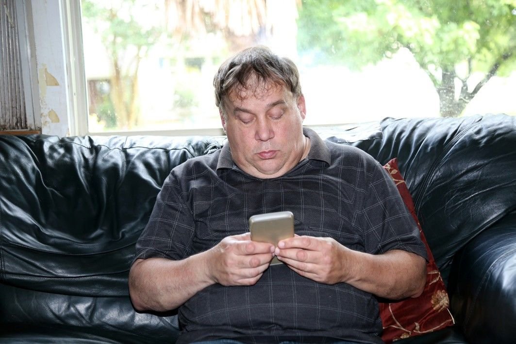 A man texting on a mobile phone