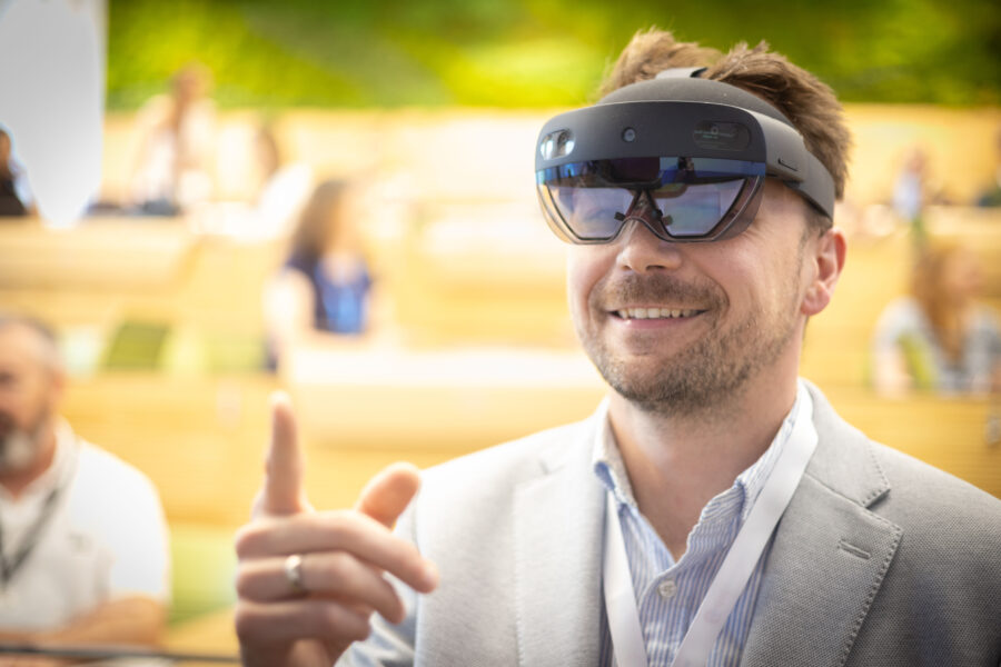 Image of man with AI headset on