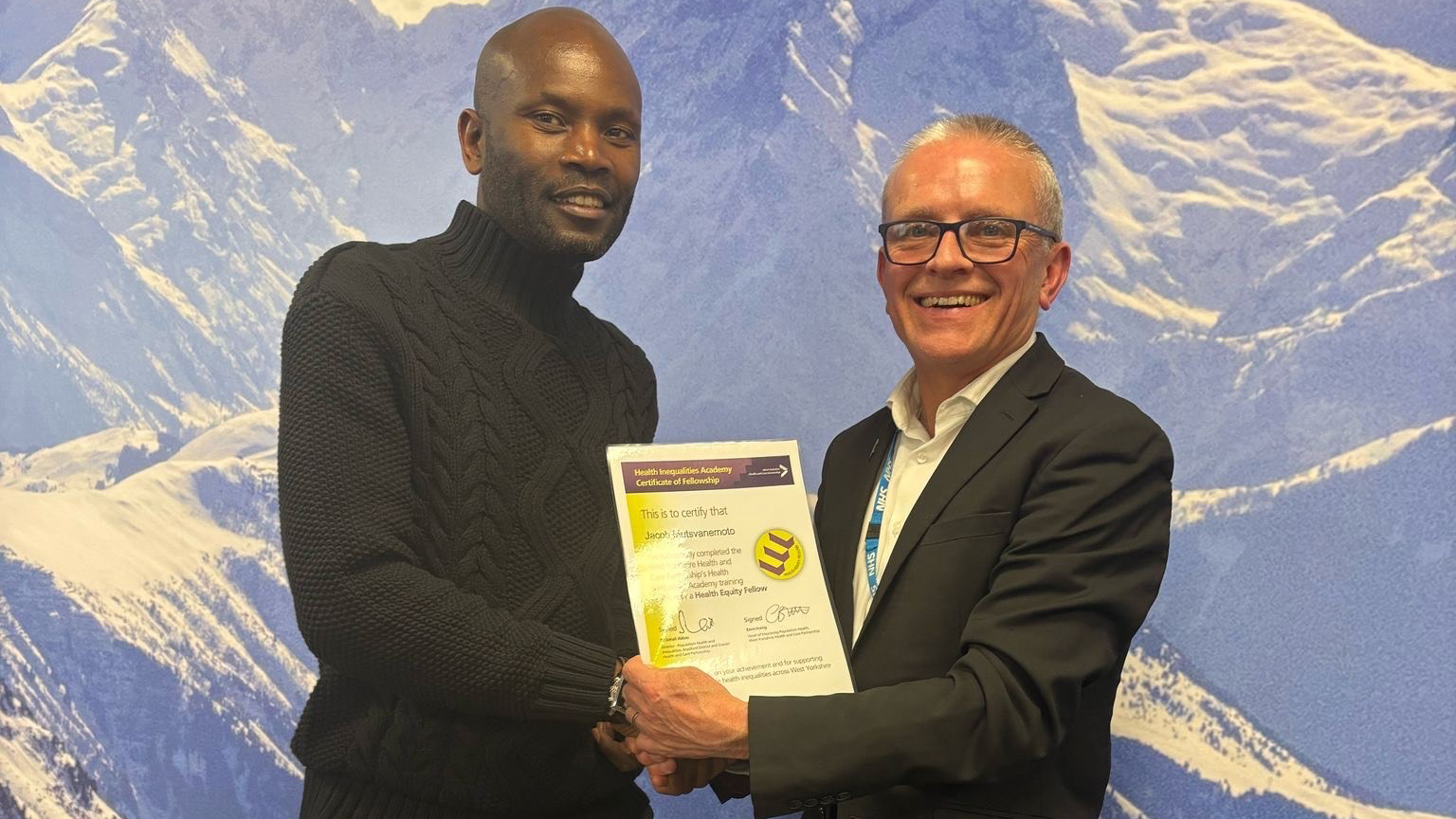 Jacob receiving his certificate and Robin Tuddenham