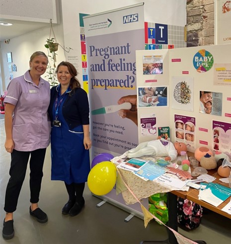 A photograph from baby week Leeds, 2023 using the 'Speak with a midwife' resources