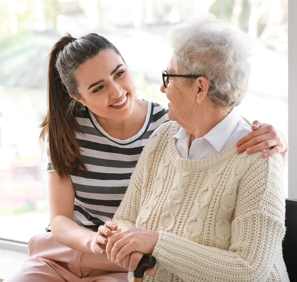 Young woman with the elderly lady she cares for