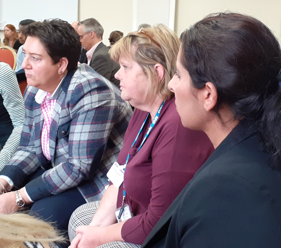 colleagues listening at a training and development session