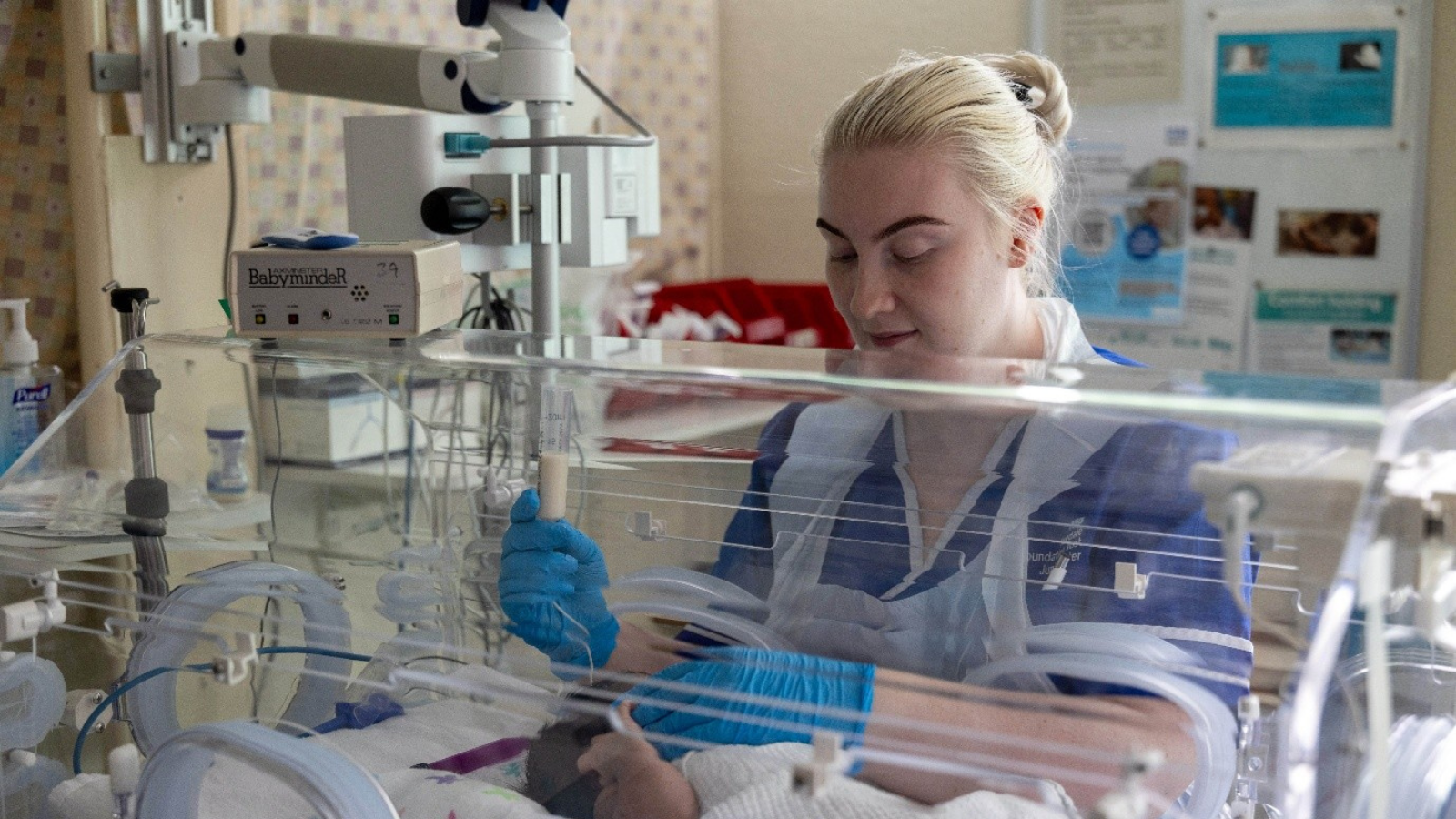 Image of nurse caring for a baby