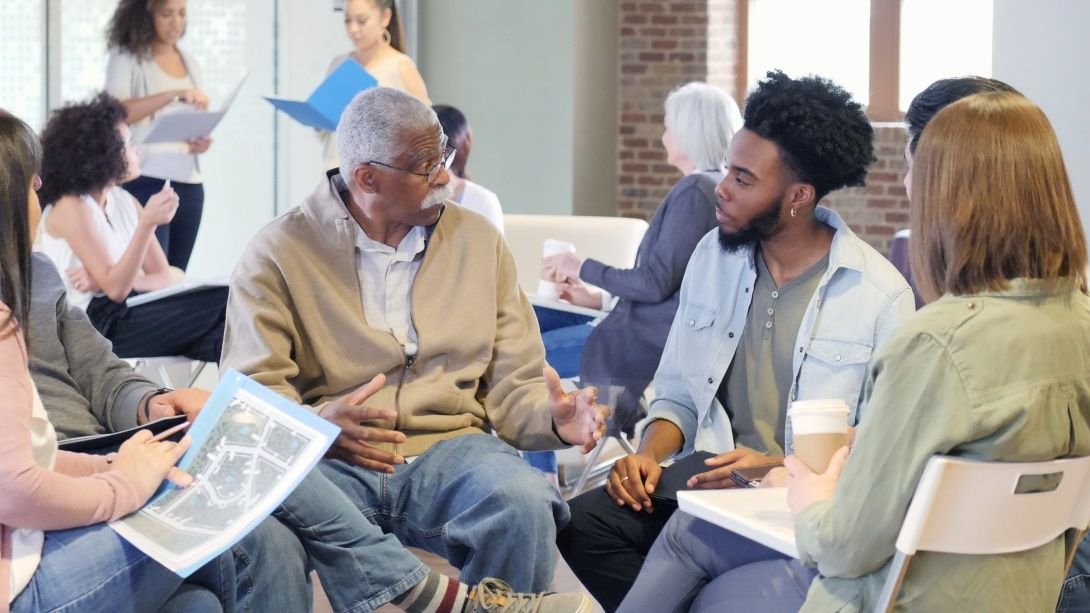 Group of people in conversation [stock image]