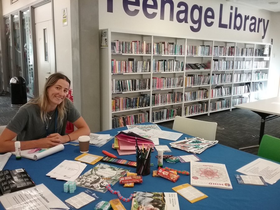 Arlie Haslam pictured at a table in a library.jpg