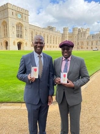 Dr Owen Williams and Wallace Sampson with their OBE medals