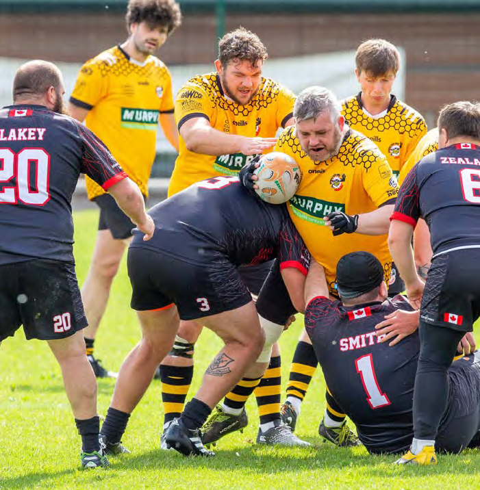 Photo of Anthony Brooke playing mixed ability rugby.